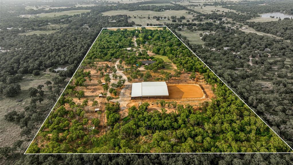 3113 Rock Creek Road Mineral Wells, TX 76067 - Photo 36 of 37 an aerial view of a residential houses with yard