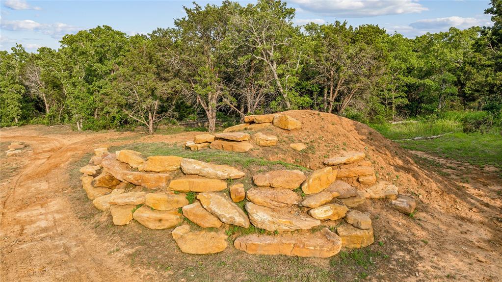 3113 Rock Creek Road Mineral Wells, TX 76067 - Photo 37 of 37 a view of white house with a yard