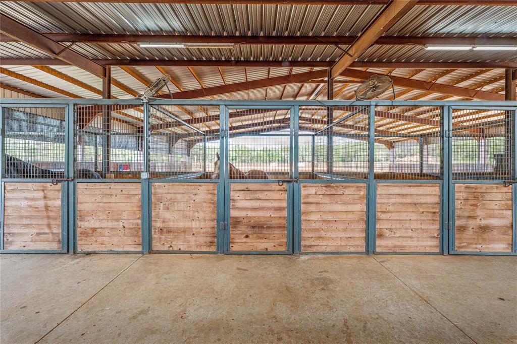 3113 Rock Creek Road Mineral Wells, TX 76067 - Photo 4 of 37 a view of an empty room with wooden floor
