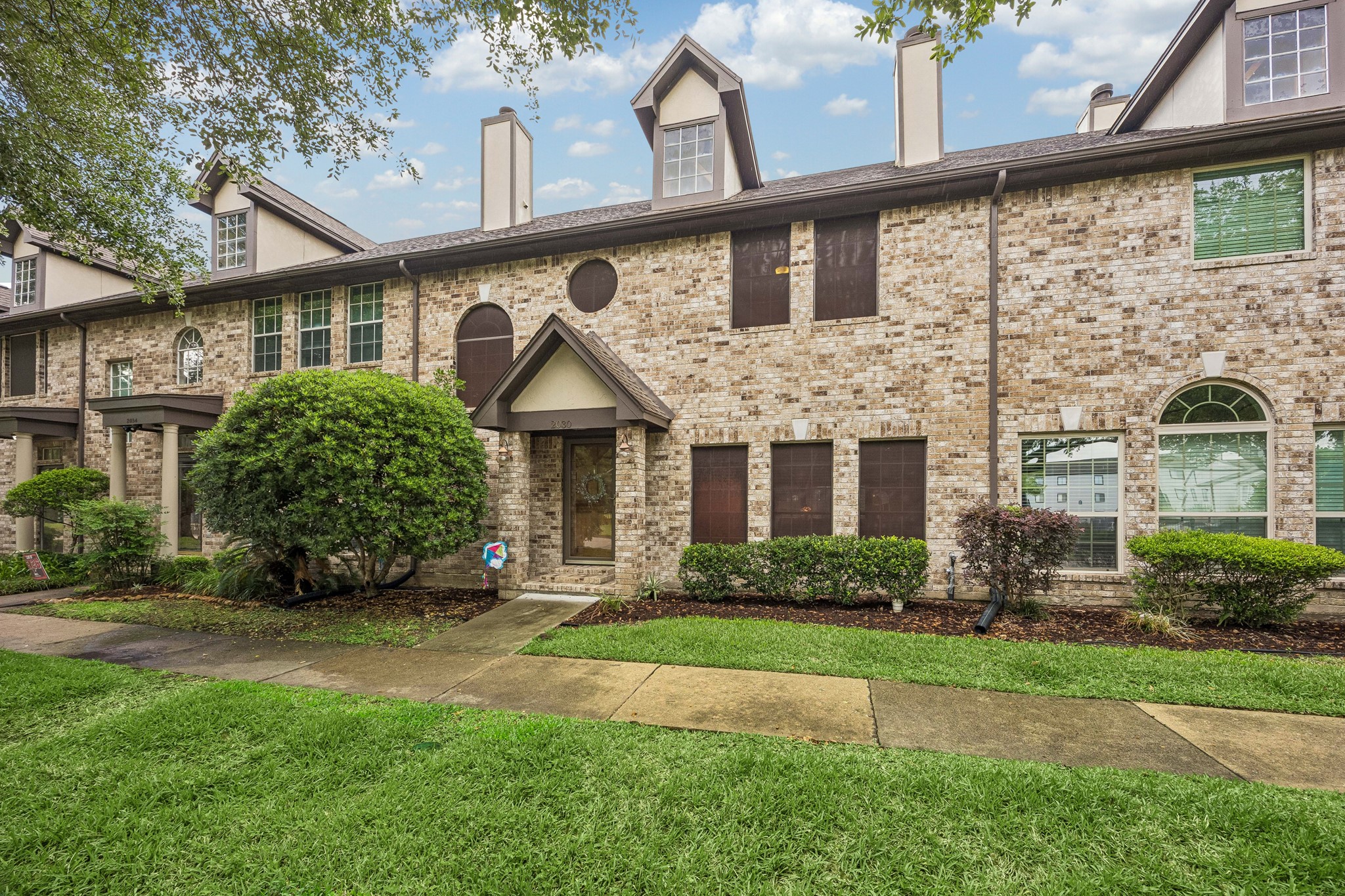 2030 Gemini Street Houston, TX 77058 - Photo 1 of 25 a front view of a house with a yard and garage