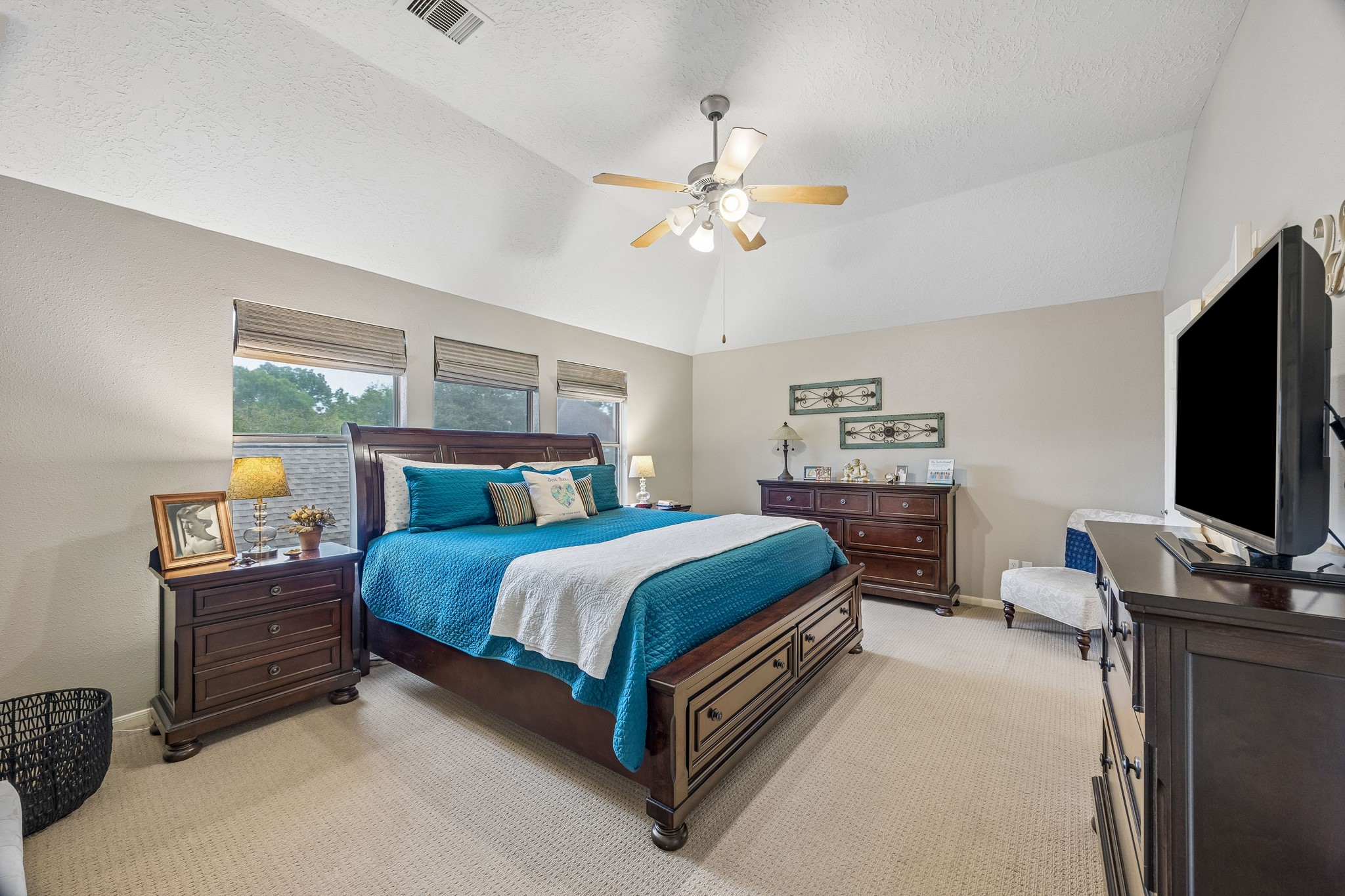 2030 Gemini Street Houston, TX 77058 - Photo 14 of 25 a bedroom with a bed and a flat screen tv