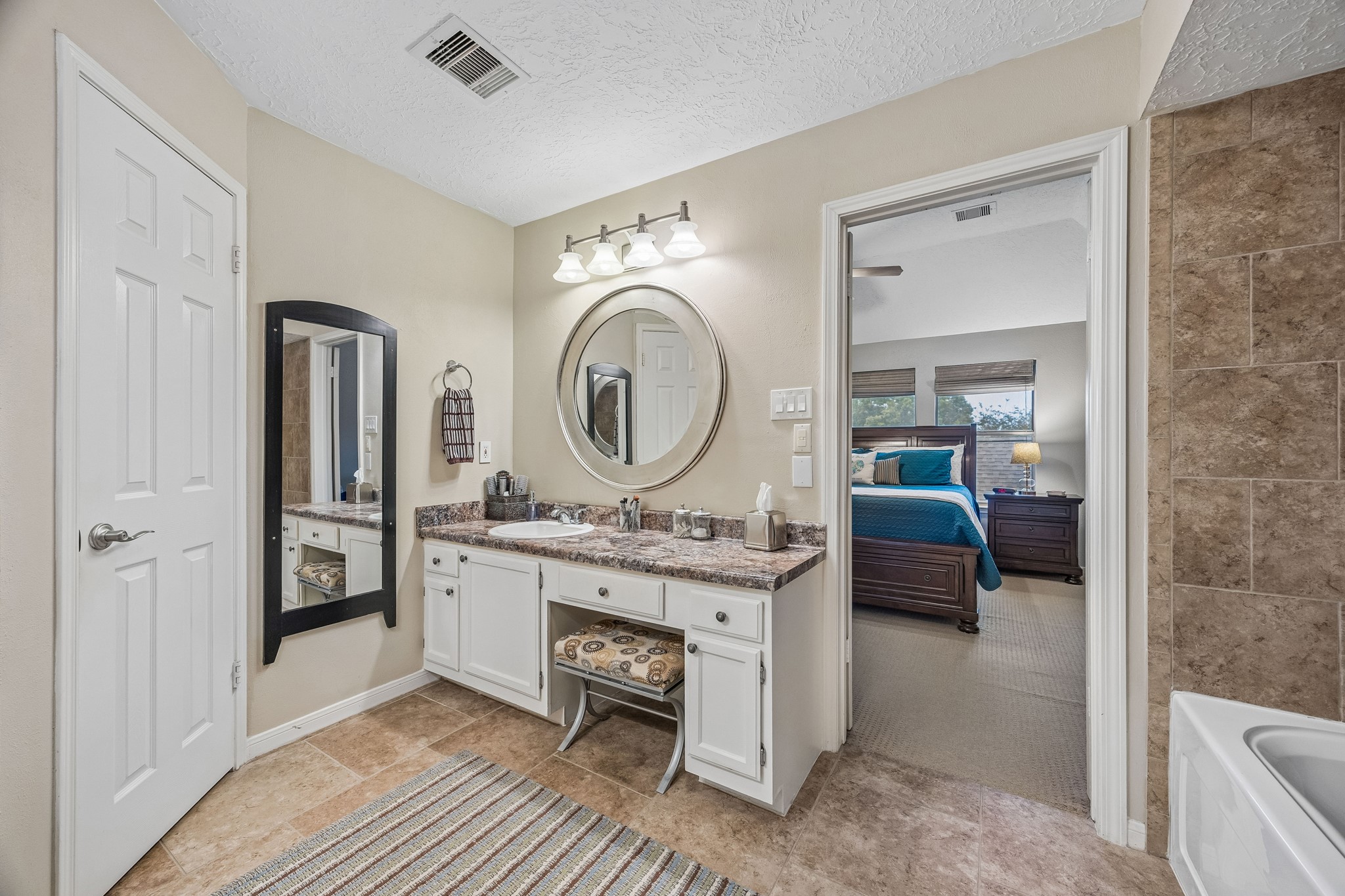 2030 Gemini Street Houston, TX 77058 - Photo 17 of 25 a very nice looking room with a large mirror and a sink