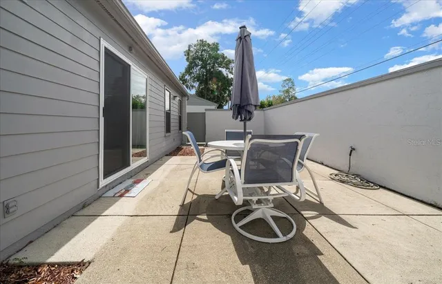 a view of a backyard with plants and a garden