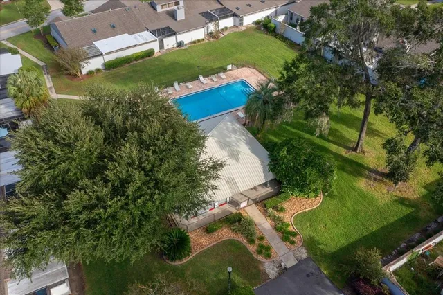 a bathroom with a double vanity sink toilet mirror and bathtub