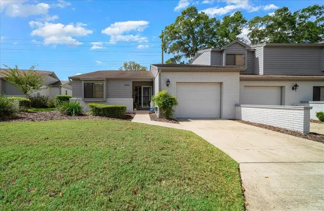 a view of house with yard