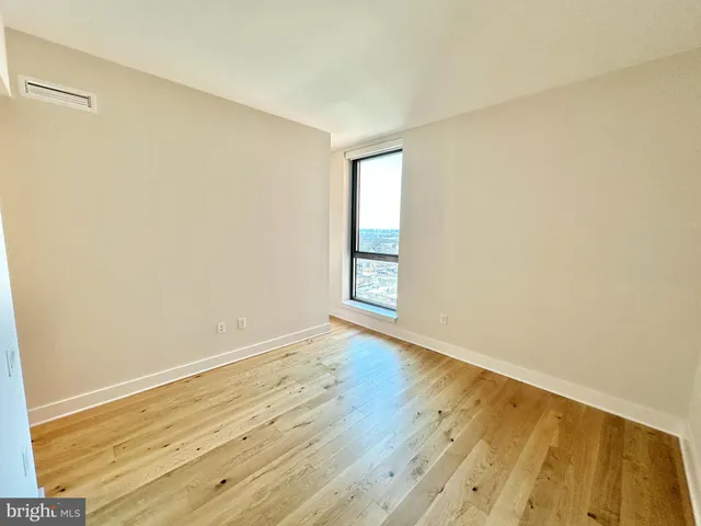 a bathroom with a shower and toilet