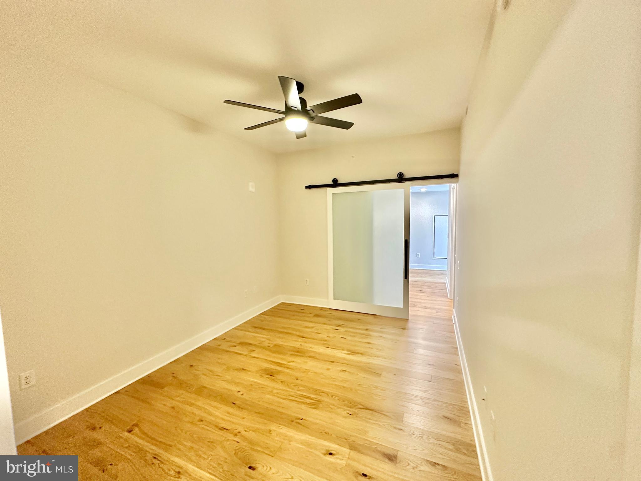 1211 Van Street Southeast, Unit 1201 Washington, DC 20003 - Photo 30 of 60 a view of empty room with wooden floor