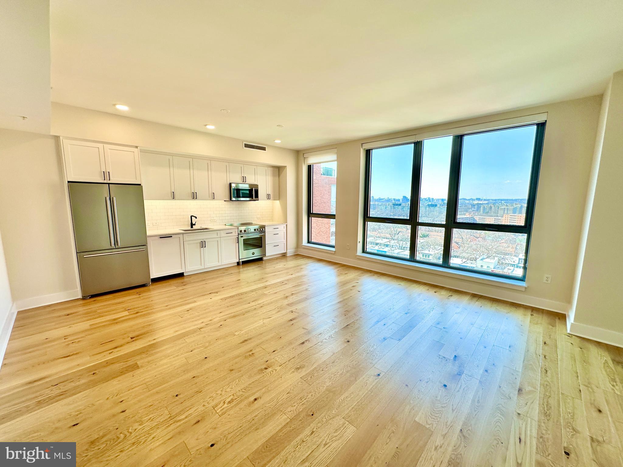 1211 Van Street Southeast, Unit 1201 Washington, DC 20003 - Photo 3 of 60 a view of empty room with wooden floor and fan