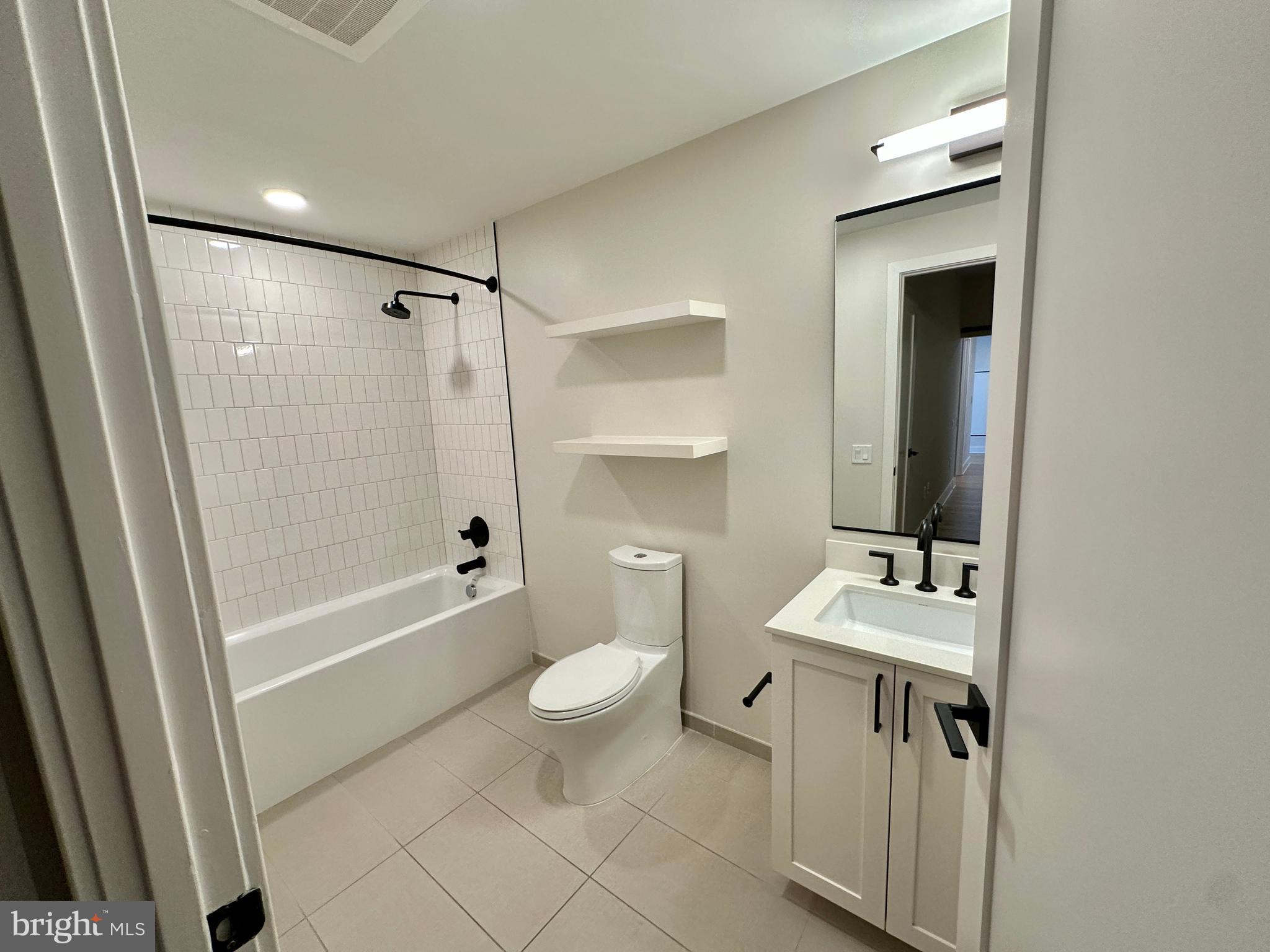 1211 Van Street Southeast, Unit 1201 Washington, DC 20003 - Photo 32 of 60 a bathroom with a sink a toilet and shower