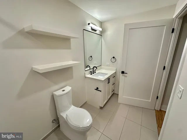 a view of a balcony with a table and chairs