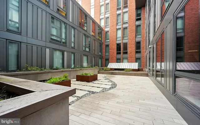 a view of a patio with a dining table and chairs