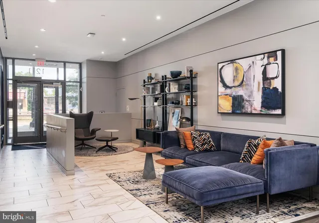 a living room with furniture and a rug