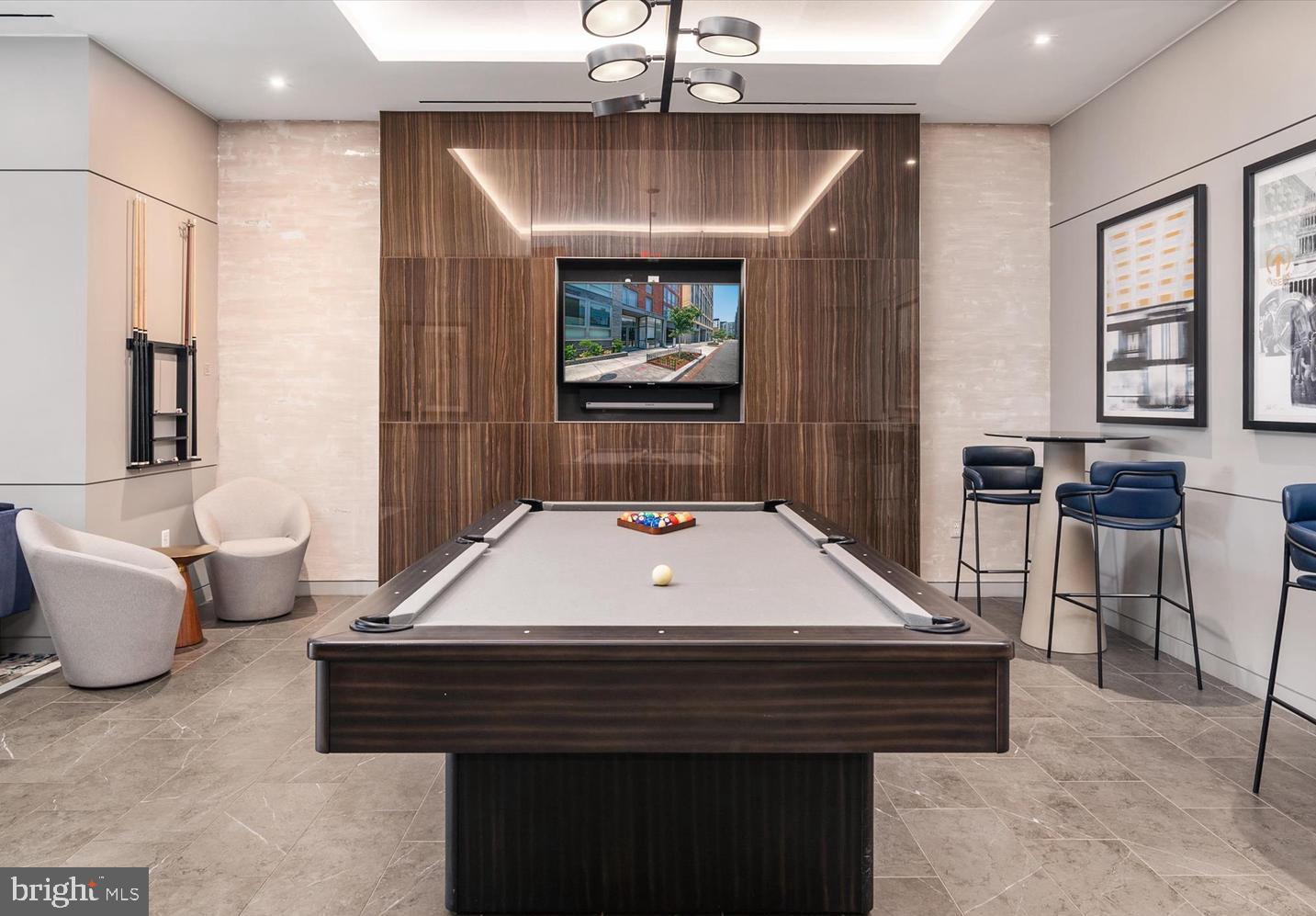1211 Van Street Southeast, Unit 1201 Washington, DC 20003 - Photo 50 of 60 a room with pool table and windows