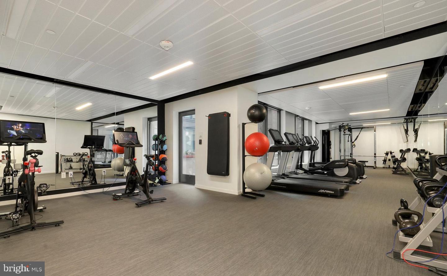 1211 Van Street Southeast, Unit 1201 Washington, DC 20003 - Photo 52 of 60 a view of a room with gym equipment