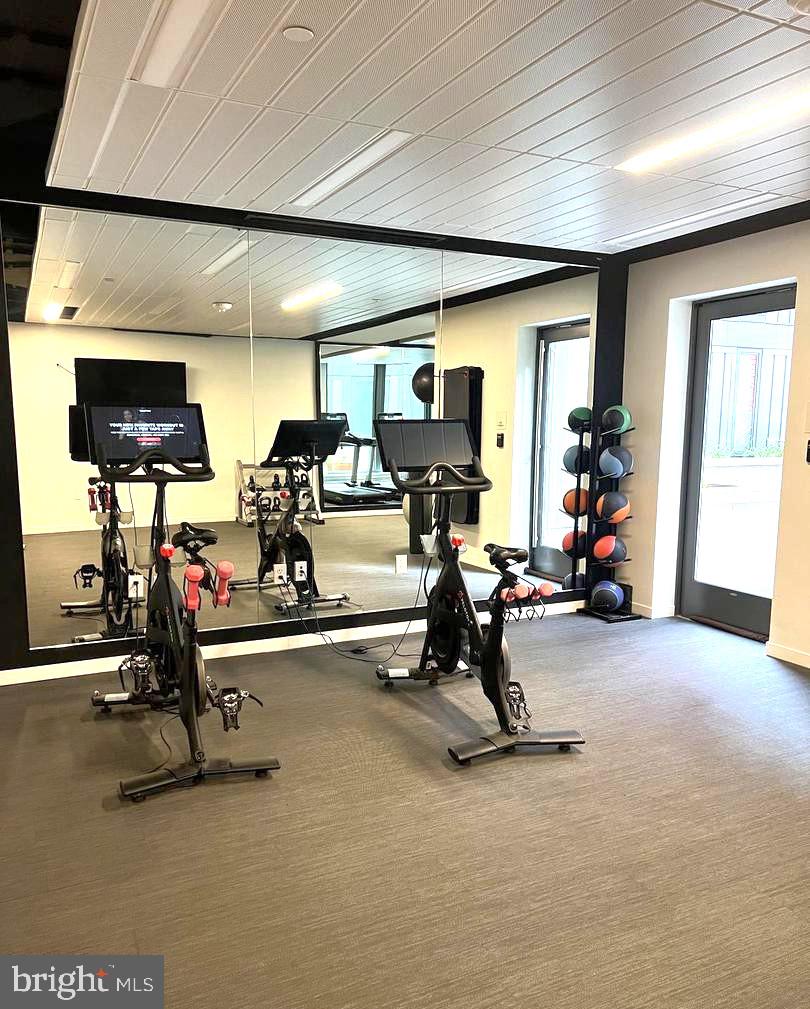 1211 Van Street Southeast, Unit 1201 Washington, DC 20003 - Photo 53 of 60 a view of a room with gym equipment