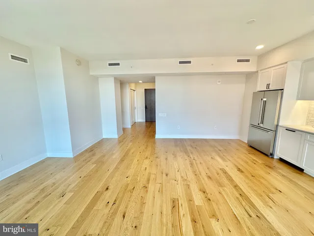 a view of kitchen and wooden floor