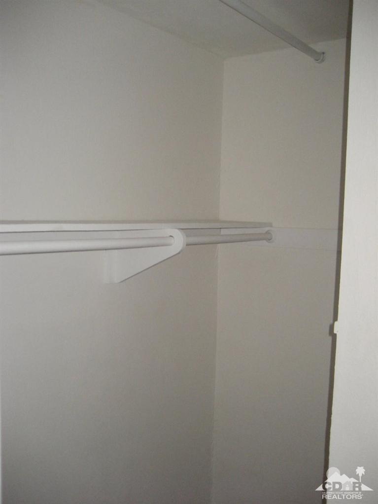 72694 Eagle Road, Unit 3 Palm Desert, CA 92260 - Photo 17 of 35 a view of a room with racks on the wall