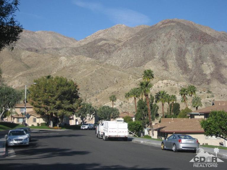 72694 Eagle Road, Unit 3 Palm Desert, CA 92260 - Photo 24 of 35 a car parked on the side of the road