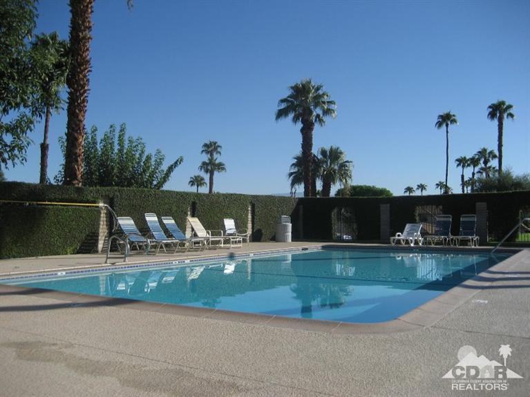 72694 Eagle Road, Unit 3 Palm Desert, CA 92260 - Photo 26 of 35 a view of a house with a yard