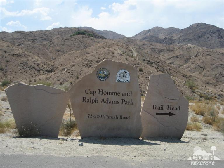72694 Eagle Road, Unit 3 Palm Desert, CA 92260 - Photo 30 of 35 a view of a wooden wall with a large tree