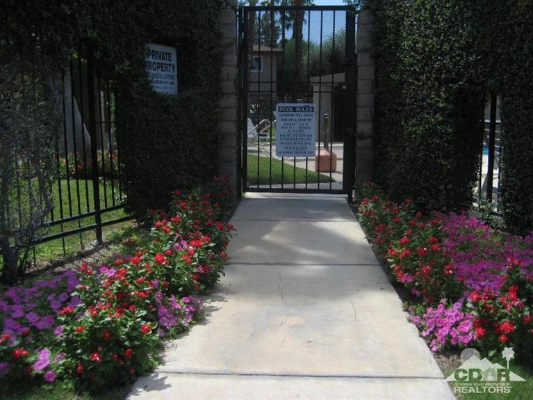 72694 Eagle Road, Unit 3 Palm Desert, CA 92260 - Photo 32 of 35 a view of a garden with flowers