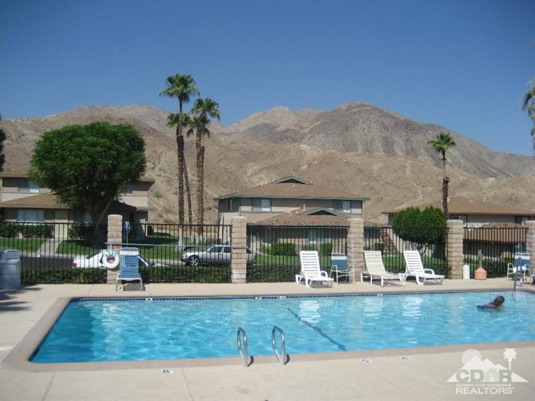 72694 Eagle Road, Unit 3 Palm Desert, CA 92260 - Photo 33 of 35 a view of a house with a garden and sitting area