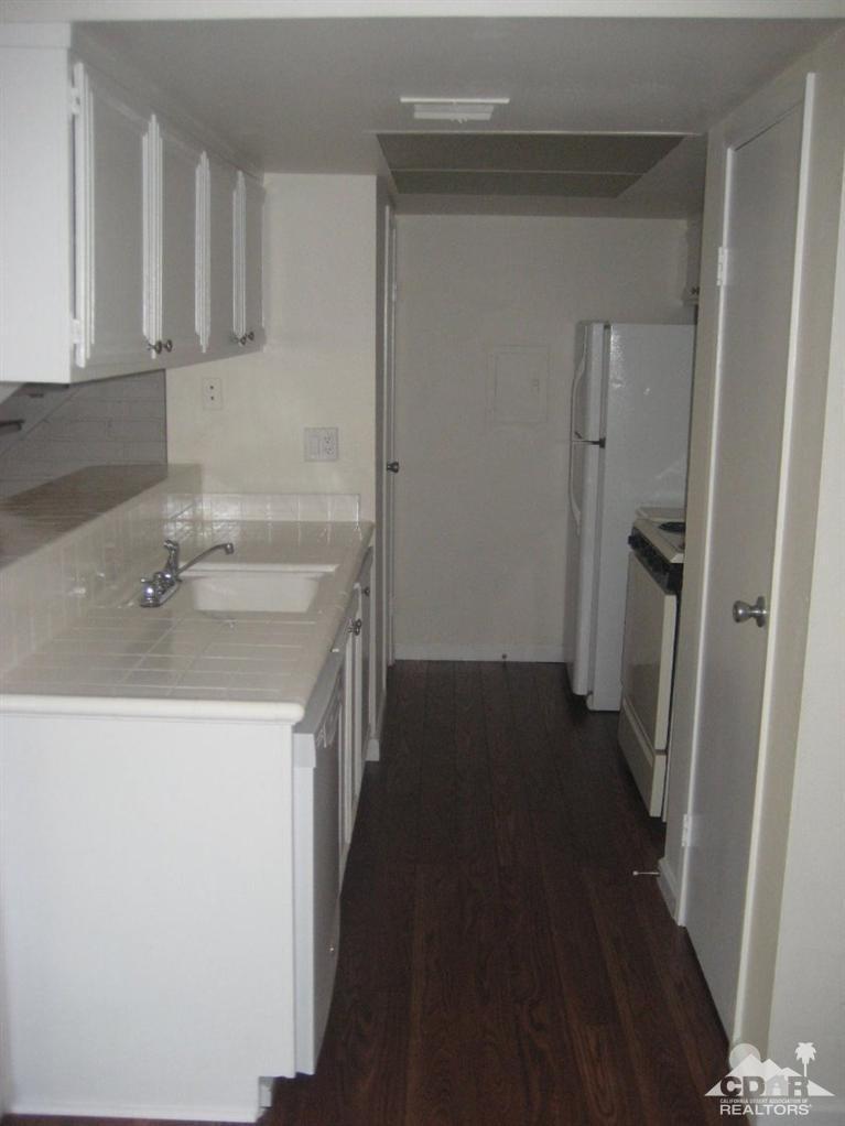 72694 Eagle Road, Unit 3 Palm Desert, CA 92260 - Photo 6 of 35 a utility room with a sink washer and dryer