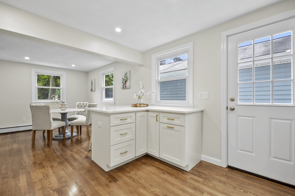 21 Woodside Road Billerica, MA 01862 - Photo 11 of 34 a room with cabinets wooden floor and a window