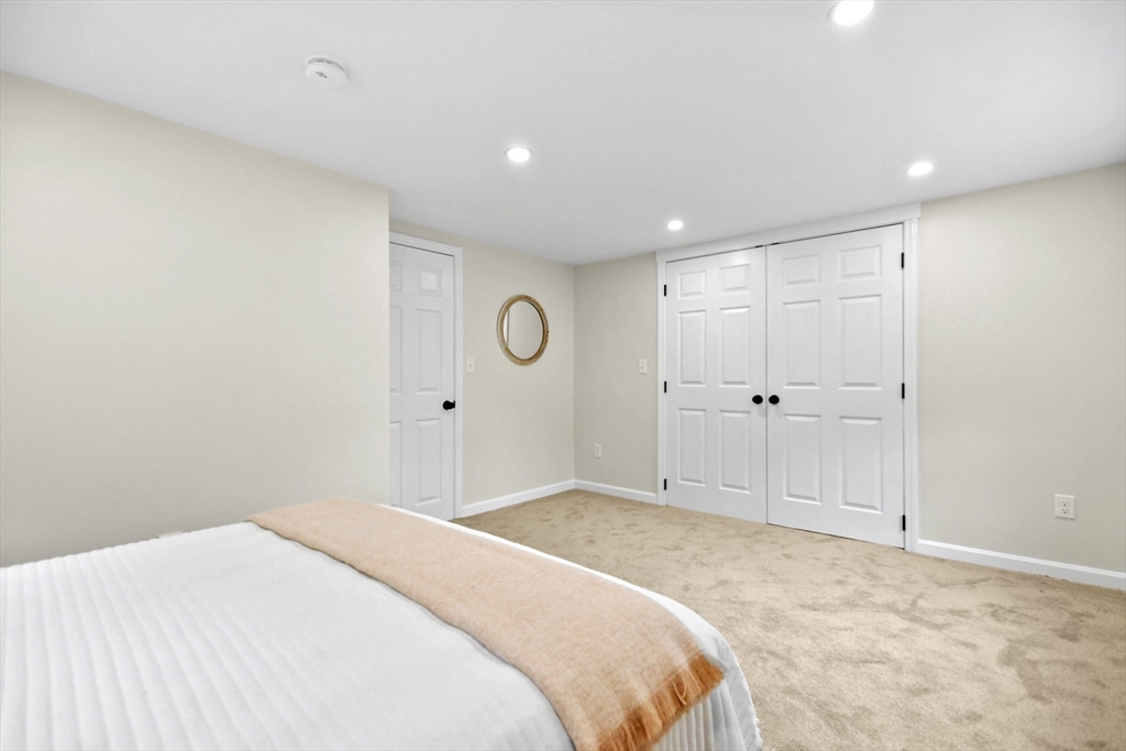 21 Woodside Road Billerica, MA 01862 - Photo 18 of 34 a bedroom with a large bed