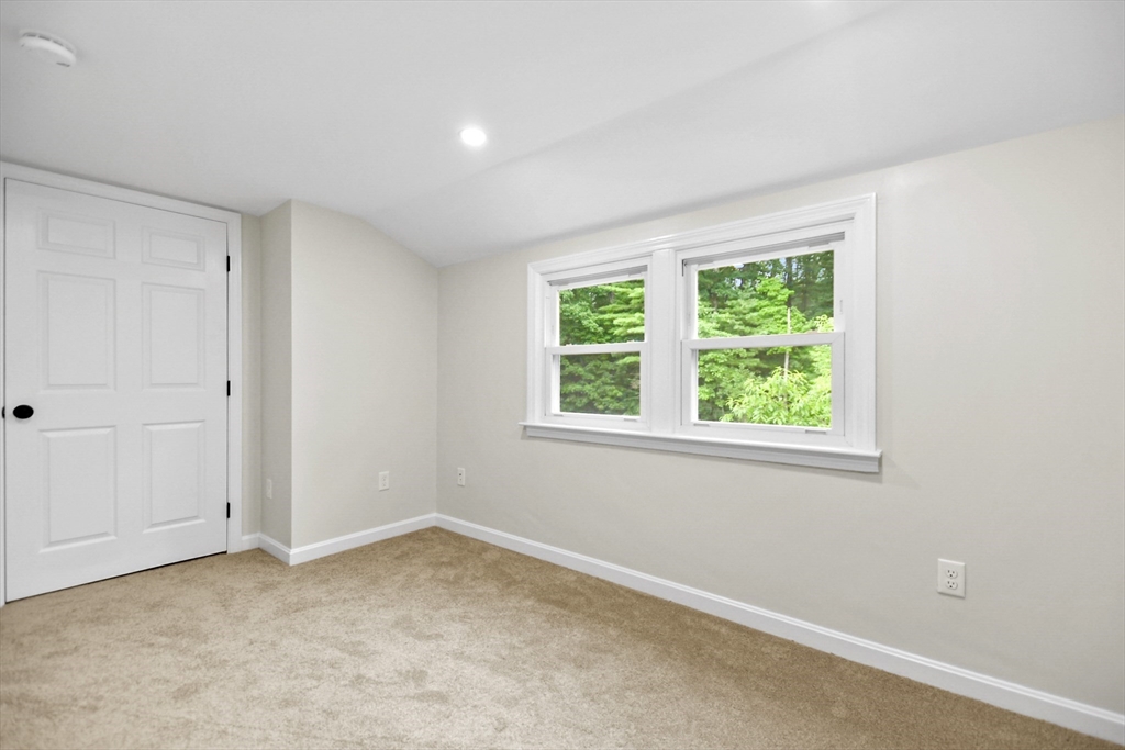 21 Woodside Road Billerica, MA 01862 - Photo 21 of 34 an empty room with a window