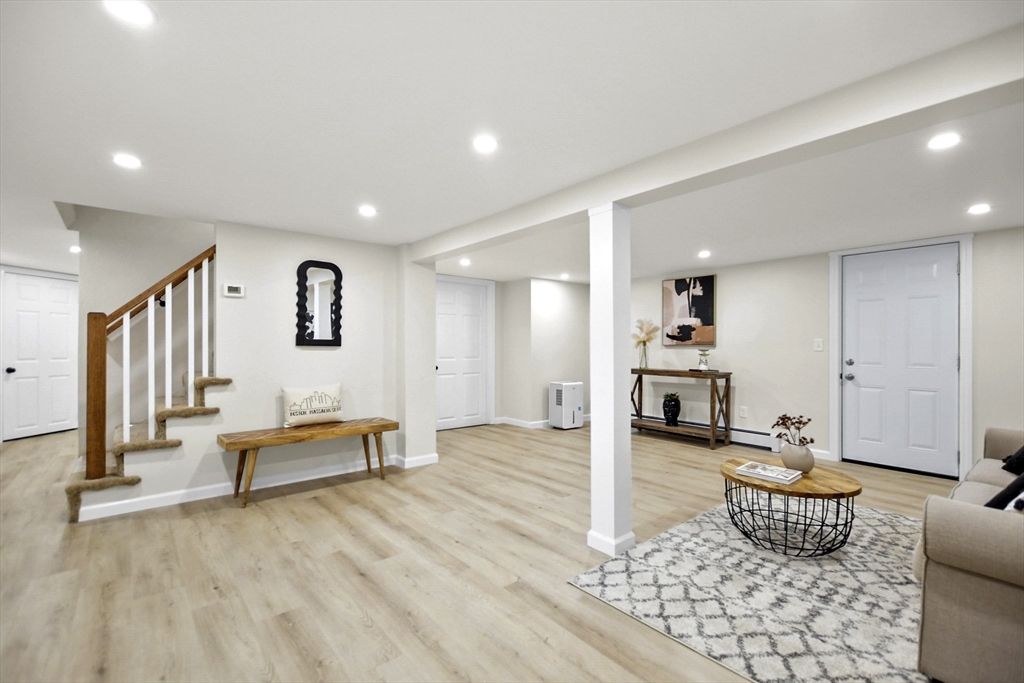 21 Woodside Road Billerica, MA 01862 - Photo 24 of 34 a living room with furniture and wooden floor
