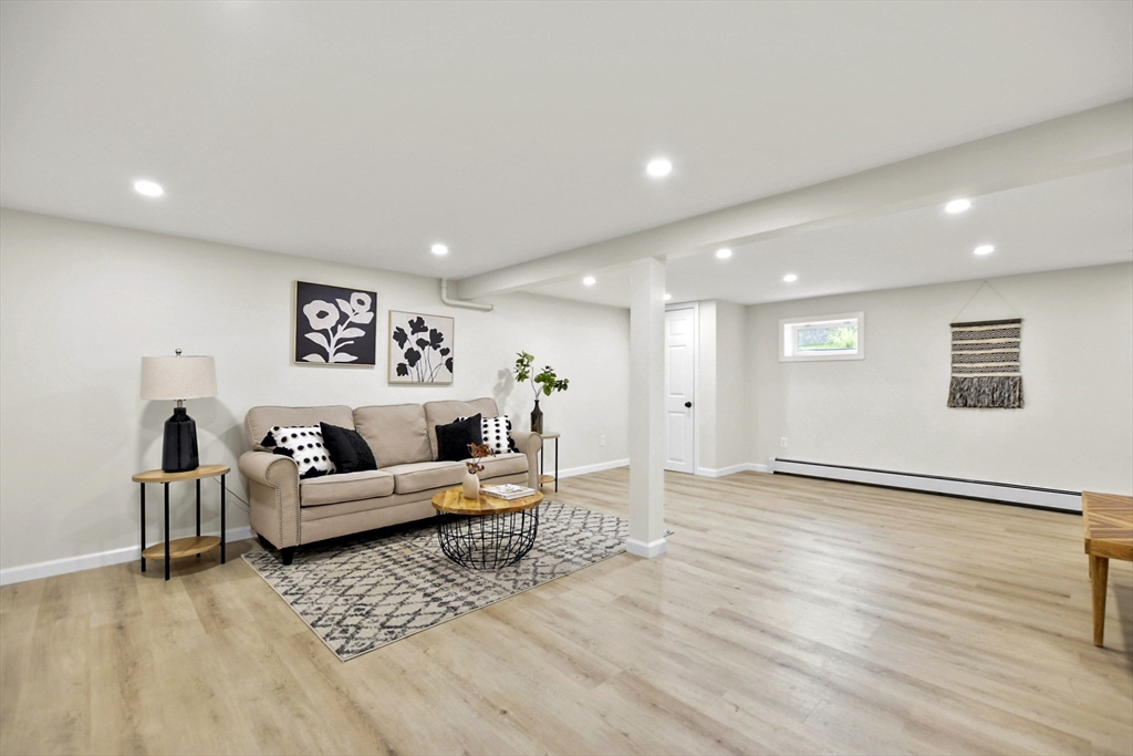 21 Woodside Road Billerica, MA 01862 - Photo 26 of 34 a living room with furniture and wooden floor