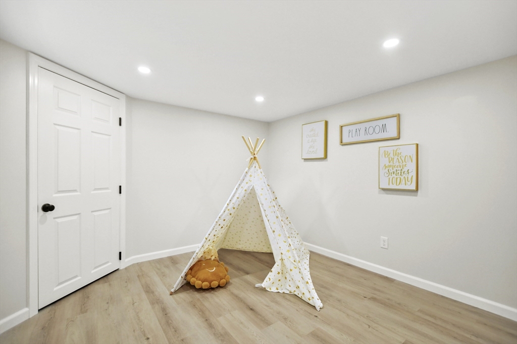 21 Woodside Road Billerica, MA 01862 - Photo 29 of 34 a view of a room with wooden floor