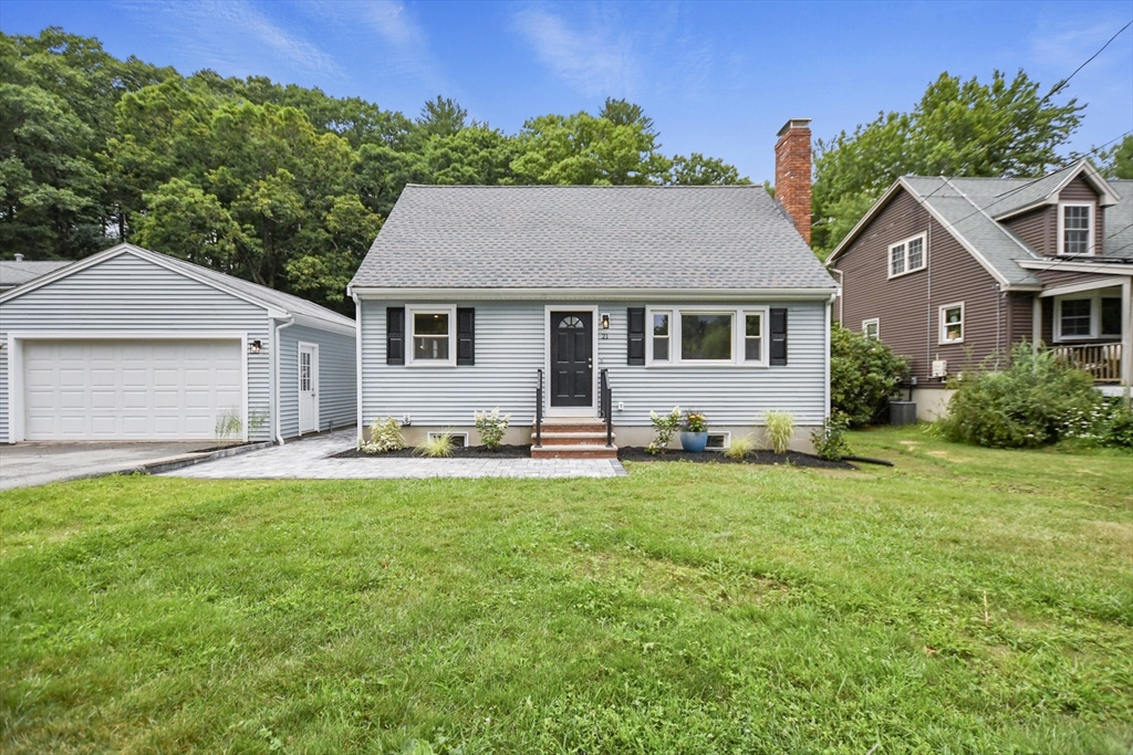 21 Woodside Road Billerica, MA 01862 - Photo 3 of 34 a house that has a big yard with wooden fence