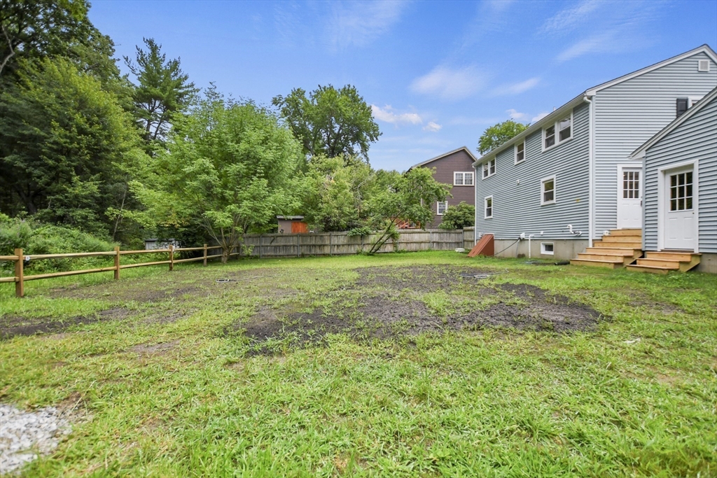 21 Woodside Road Billerica, MA 01862 - Photo 32 of 34 a view of a house with backyard