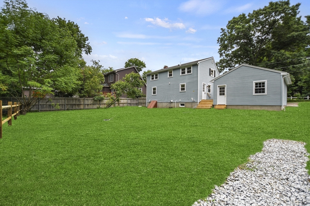 21 Woodside Road Billerica, MA 01862 - Photo 33 of 34 a front view of house with yard and green space