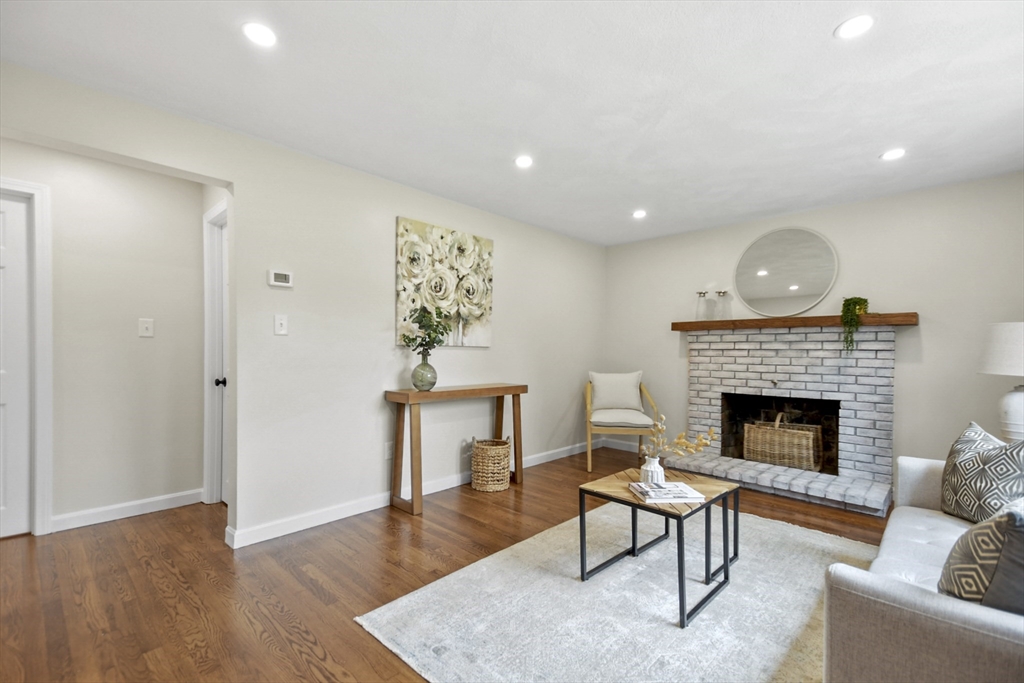 21 Woodside Road Billerica, MA 01862 - Photo 5 of 34 a living room with furniture and a fireplace