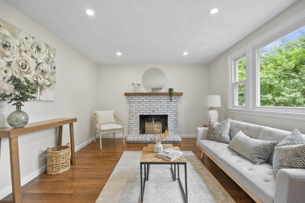 21 Woodside Road Billerica, MA 01862 - Photo 6 of 34 a living room with furniture and a fireplace