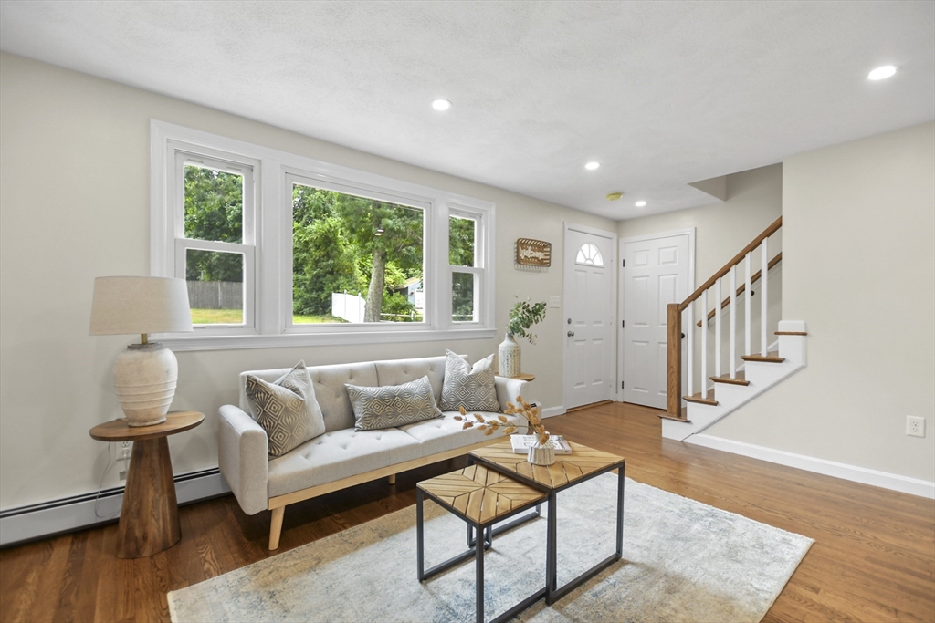 21 Woodside Road Billerica, MA 01862 - Photo 7 of 34 a living room with furniture and a wooden floor