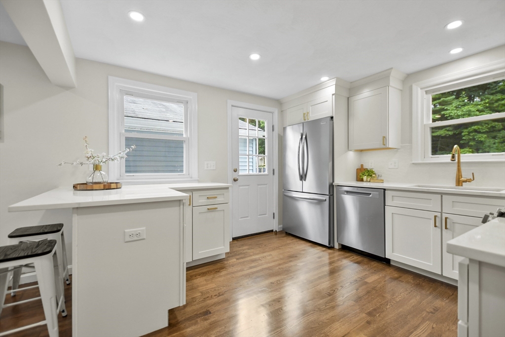 21 Woodside Road Billerica, MA 01862 - Photo 10 of 34 a kitchen with a sink cabinets stainless steel appliances and window