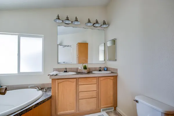 a bathroom with a tub and sink