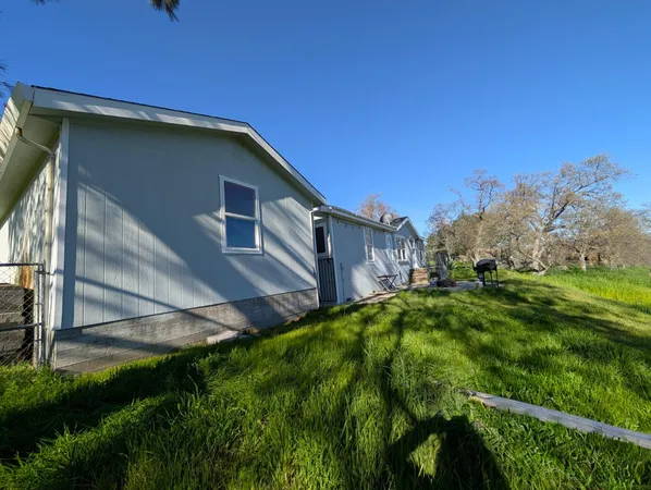 a backyard of a house with lots of green space