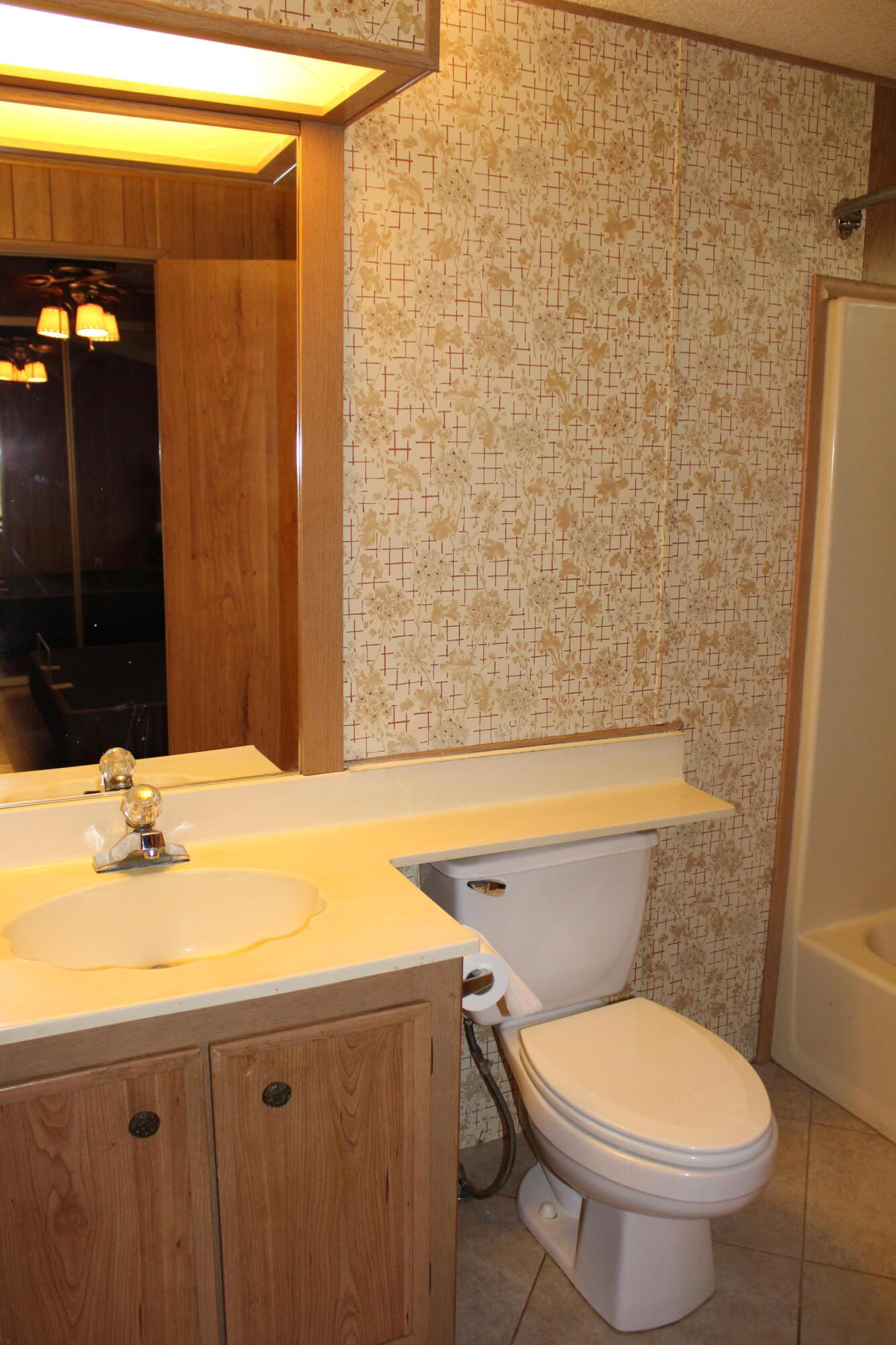 81641 Ave 48, Unit 95 Indio, CA 92201 - Photo 13 of 25 a bathroom with a sink a toilet and shower