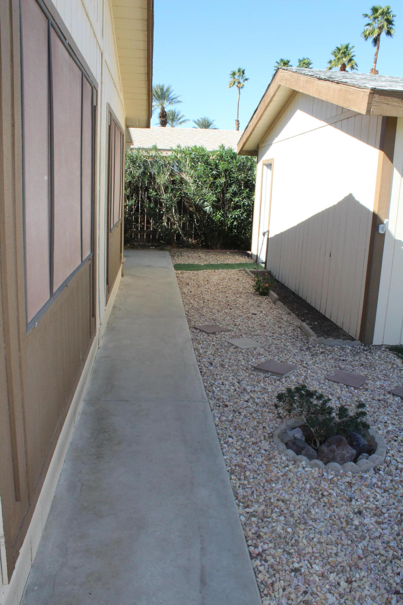 81641 Ave 48, Unit 95 Indio, CA 92201 - Photo 21 of 25 a view of a house with a backyard
