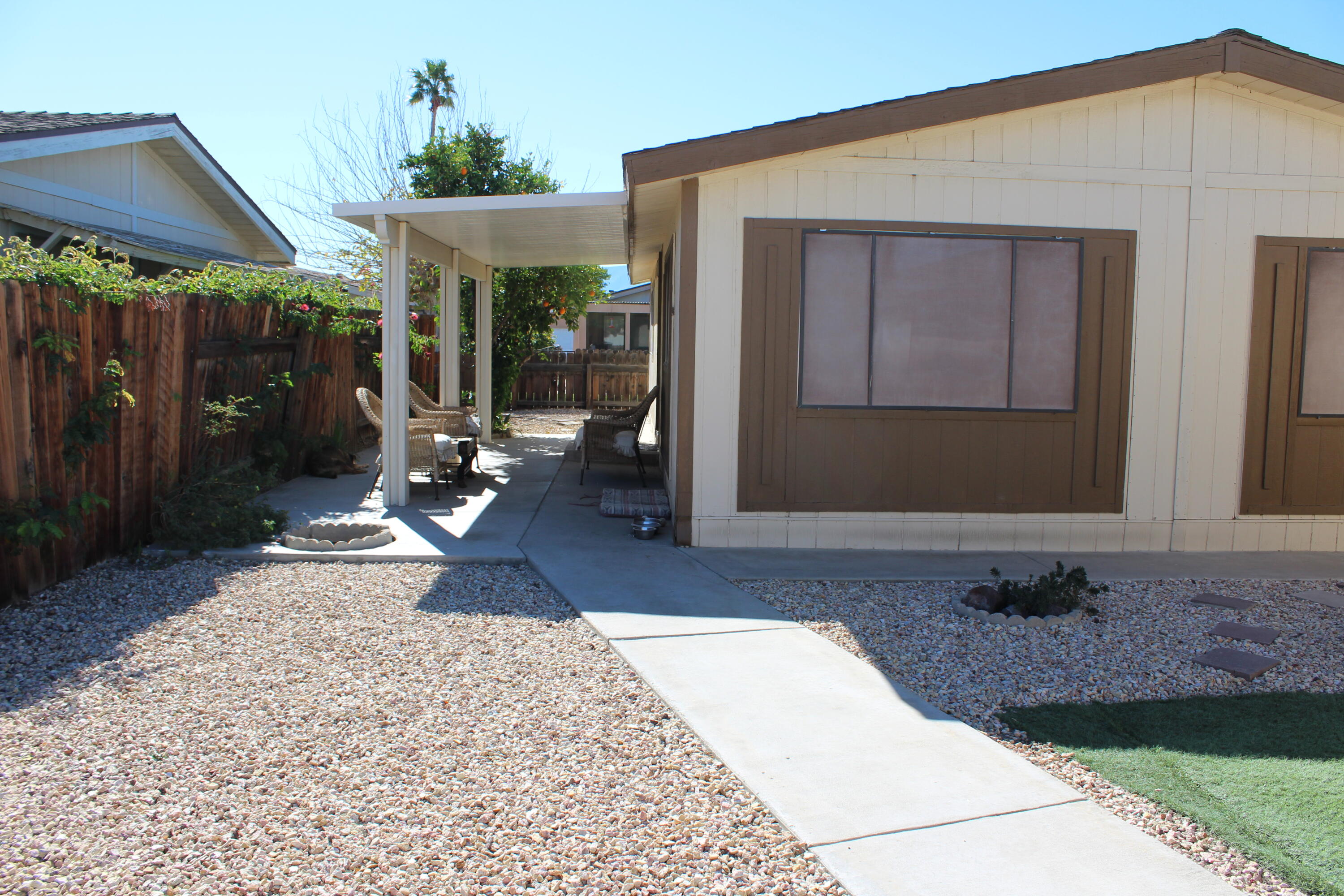 81641 Ave 48, Unit 95 Indio, CA 92201 - Photo 24 of 25 a view of a backyard with a patio