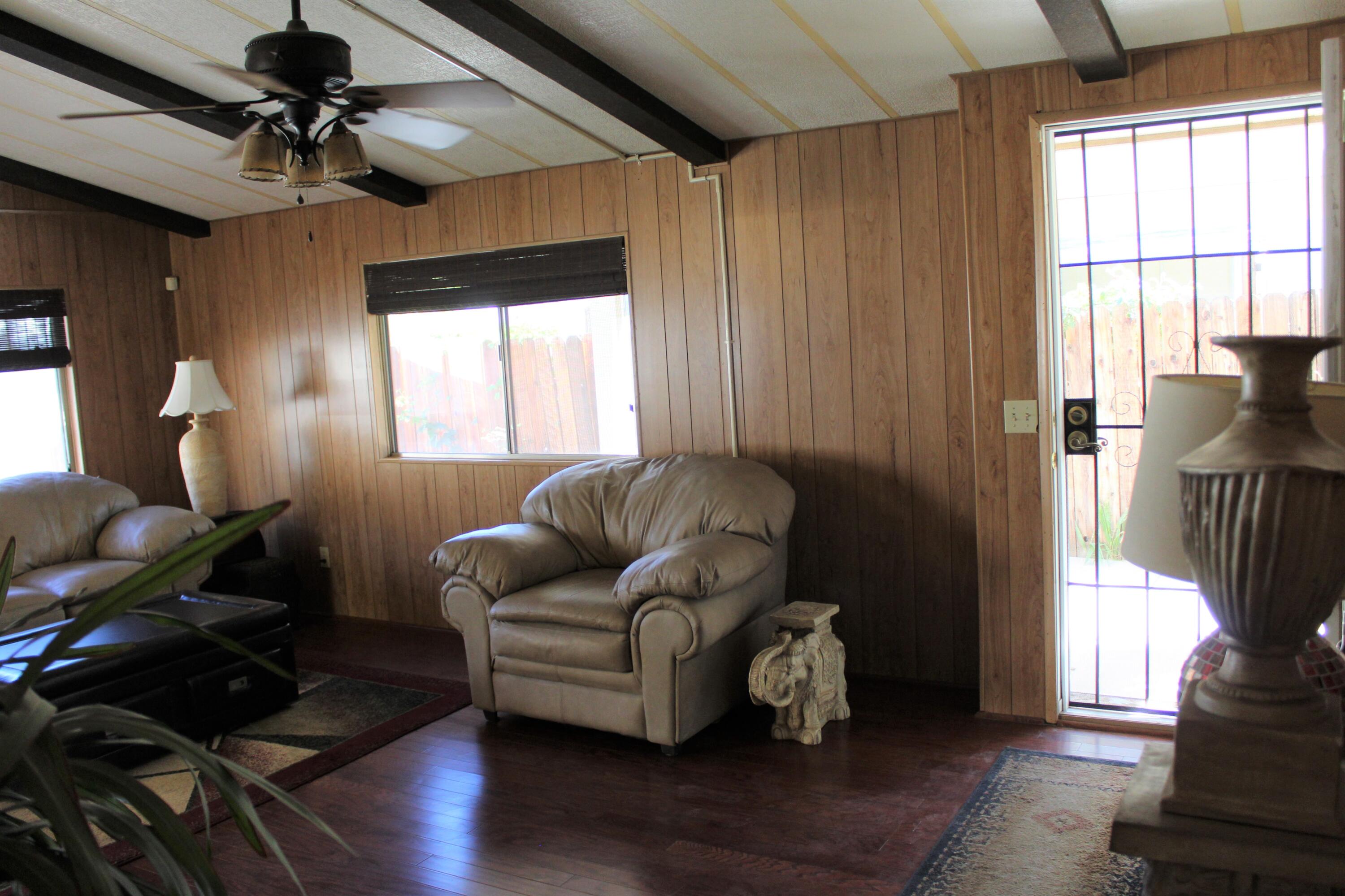 81641 Ave 48, Unit 95 Indio, CA 92201 - Photo 4 of 25 a living room with furniture and a window