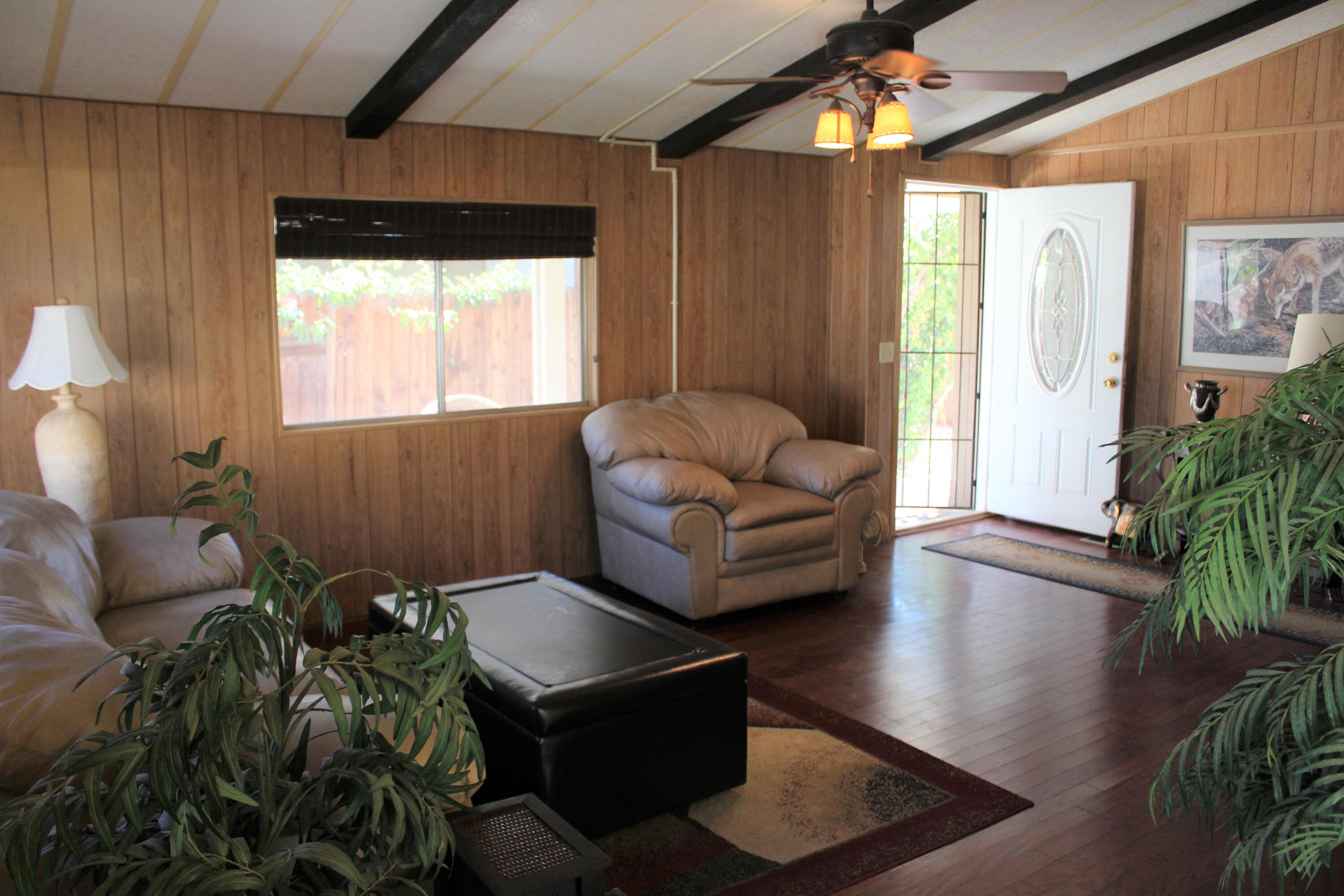 81641 Ave 48, Unit 95 Indio, CA 92201 - Photo 5 of 25 a living room with furniture and a large window