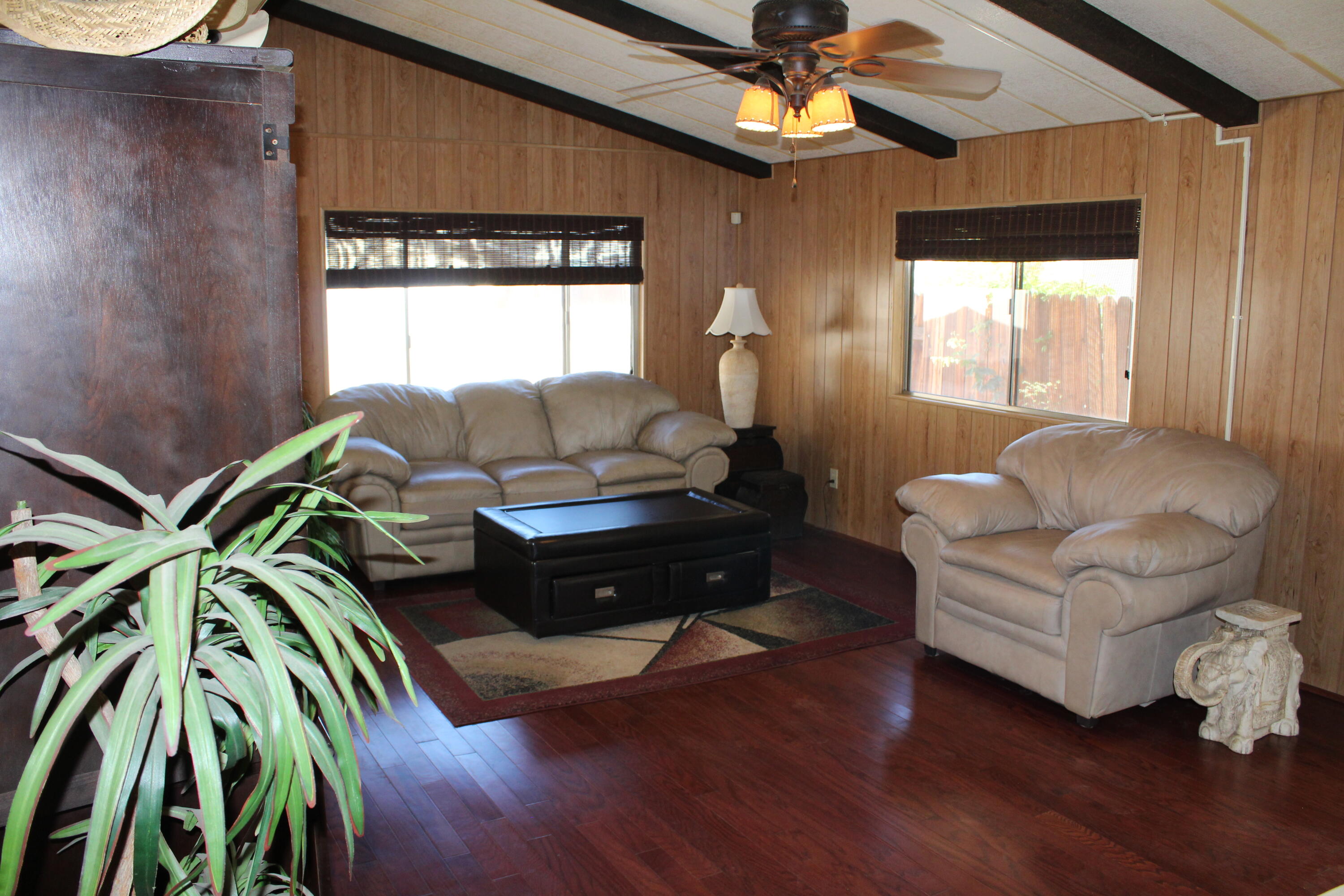 81641 Ave 48, Unit 95 Indio, CA 92201 - Photo 6 of 25 a living room with furniture and a window