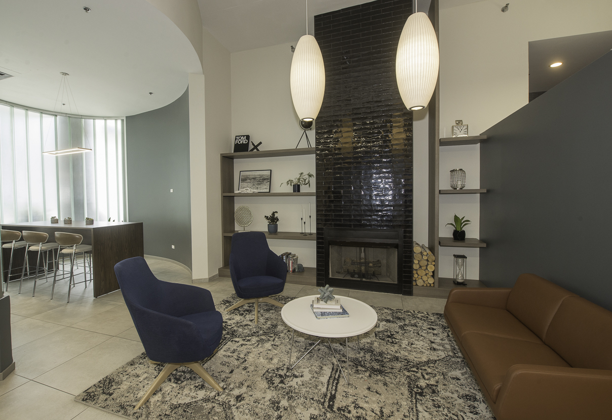 909 West Washington Boulevard, Unit 804 Chicago, IL 60607 - Photo 23 of 23 a living room with furniture a mirror and a table