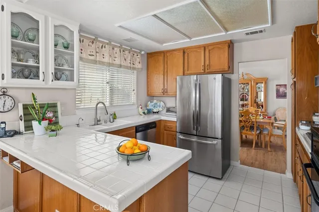 a spacious bedroom with a bed and a large window